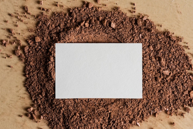 White business card on dirt