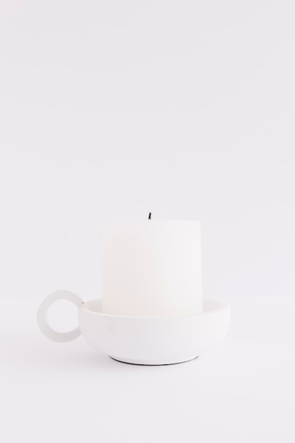 White candle in candlestick 