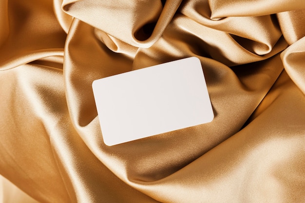 White card on golden cloth