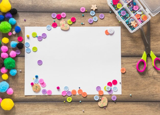 White card paper decorated with colorful buttons and beads