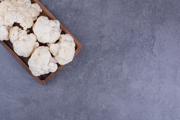 White cauliflowers isolated on concrete background.