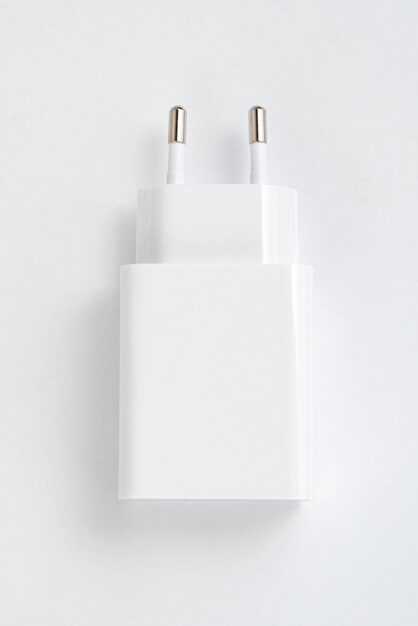 White cell phone charger on the white isolated background