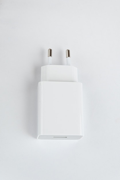 Free photo white cell phone charger on the white isolated background