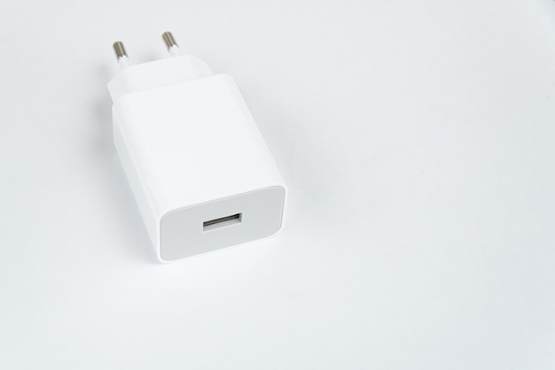 Free photo white cell phone charger on the white isolated background