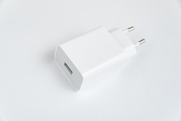 White cell phone charger on the white isolated background