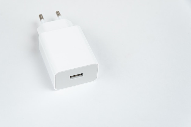 White cell phone charger on the white isolated background