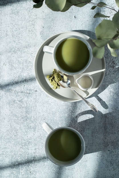 White ceramic mug with yellow liquid