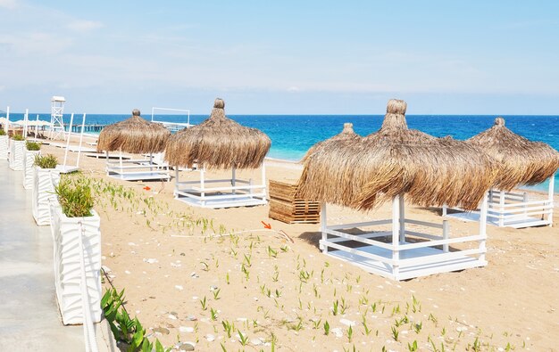 White chairs on the beach resort famous Amara Dolce Vita Luxury Hotel. Resort. Tekirova-Kemer. Turkey.