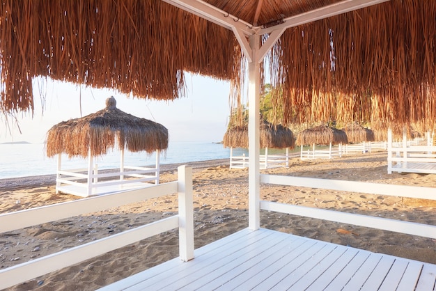 White chairs on the beach resort famous Amara Dolce Vita Luxury Hotel. Resort. Tekirova-Kemer. Turkey.
