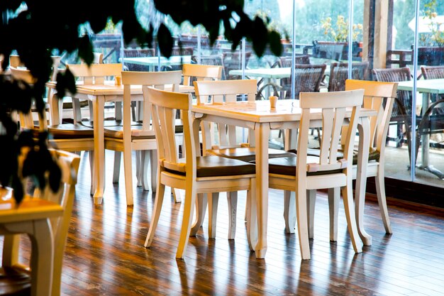 White chairs and tables in cafe