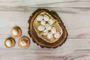 Free photo white chicken eggs in basket on wooden table