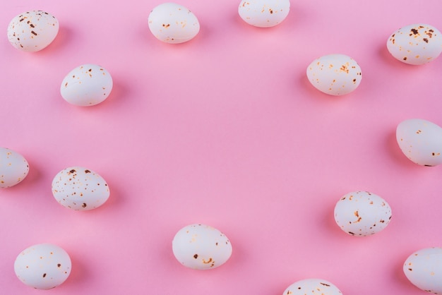 White chicken eggs scattered on table