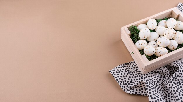 White chicken eggs in wooden box 