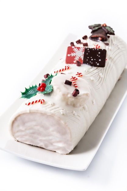 White chocolate yule log cake with ornament