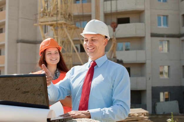 White-collar workers works on the building site