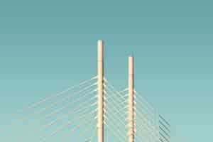 Free photo white columns and cables of a bridge with the blue sky in the background