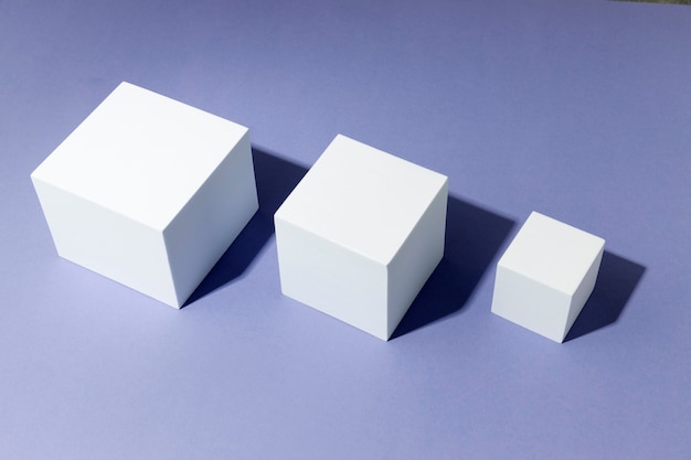 White cubes assorment on purple background