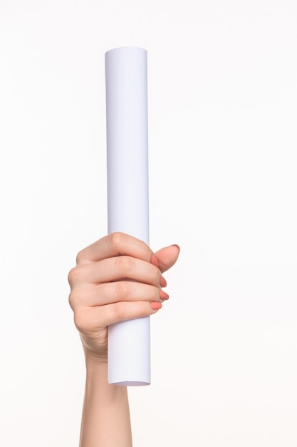 white cylinder of the props in the female hands on white background with right shadow