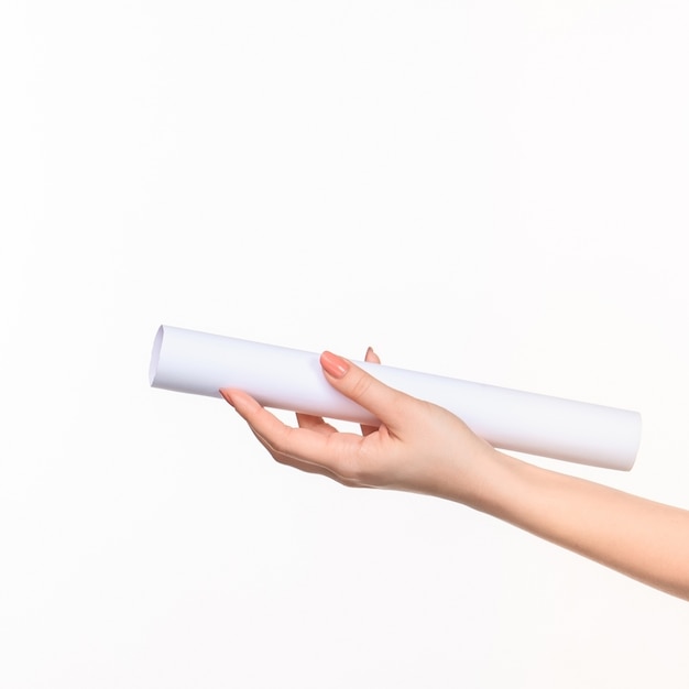 white cylinder of props in female hands on white with right shadow