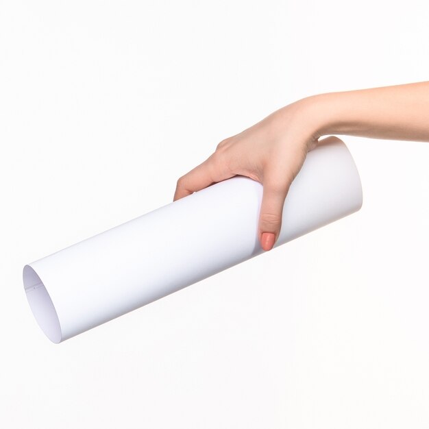 white cylinder of props in female hands on white with right shadow