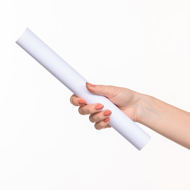 The white cylinder of the props in the female hands on white
