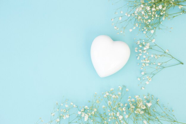 White decorative heart near plants 