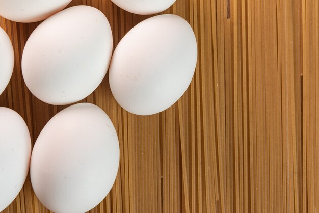 White eggs on the raw pasta