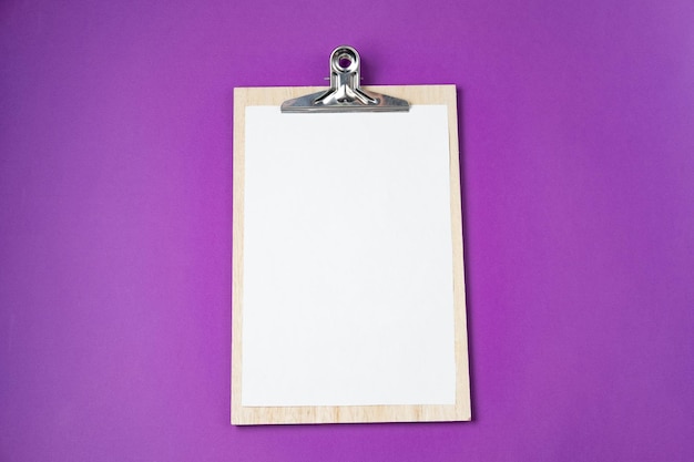White empty blank on a violet background Top view flat lay