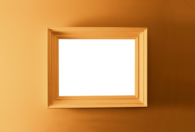 White empty frame on the bronze wall