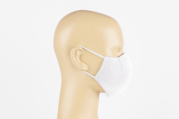 White fabric face mask on a mannequin