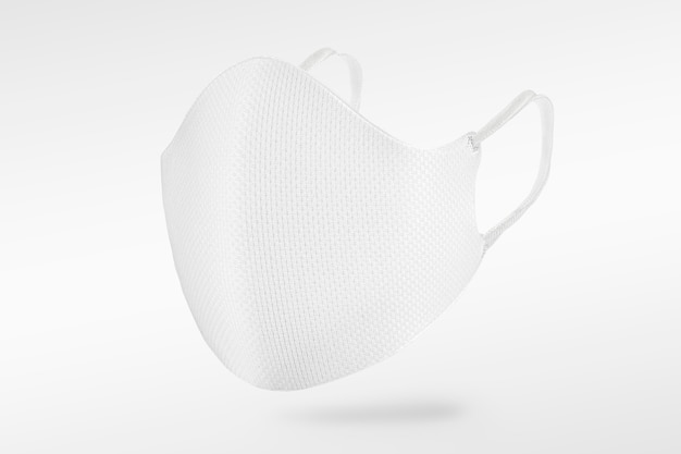 Free photo white fabric face mask on off white background