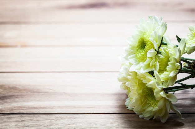 White flowers on a wooden tablet