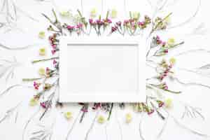 Free photo white frame on white flowers