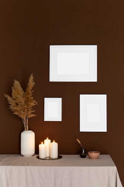 White frames and lit candles arrangement