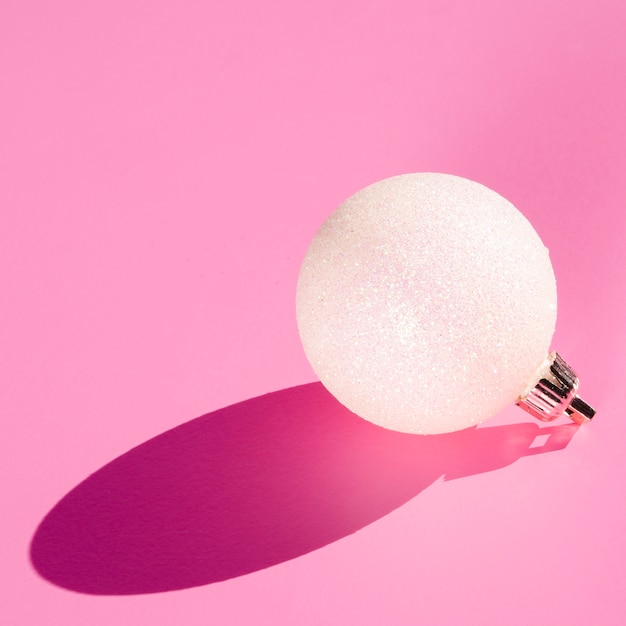 White globe on pink background