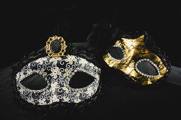 Free photo white and golden mask on a dark background