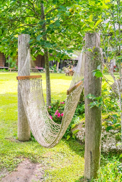 Free photo white hammocks in garden .