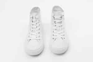 Free photo white high top sneakers unisex footwear fashion