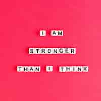 Free photo white i am stronger than i think beads words typography on red