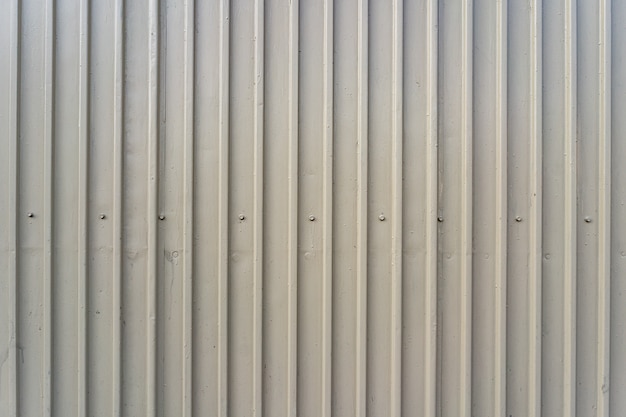 White iron tin fence lined background. Metal texture