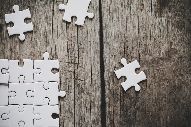 White jigsaw puzzle on a wooden table