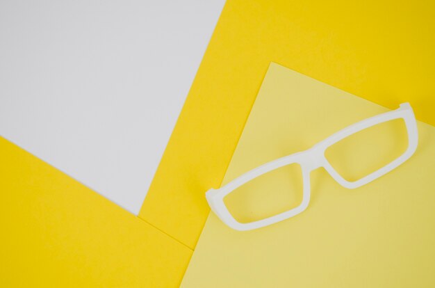 White kids eyeglasses on colorful background