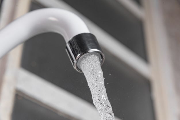 White kitchen sink faucet  - Close up