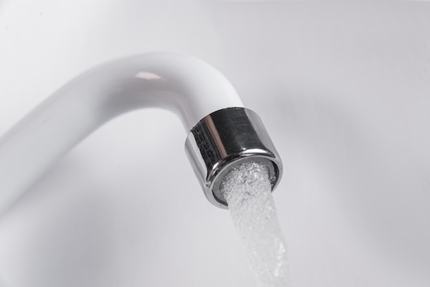 White kitchen sink faucet  - Close up