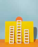 Free photo white ladders with orange circle