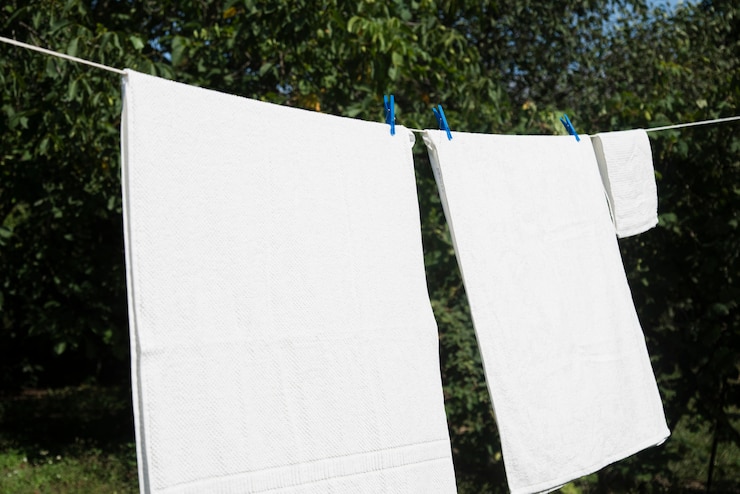 Free Photo white laundry hanging on a string outdoors