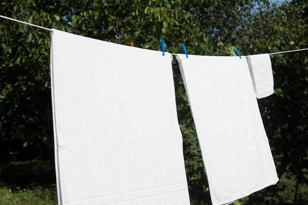 White laundry hanging on a string outdoors