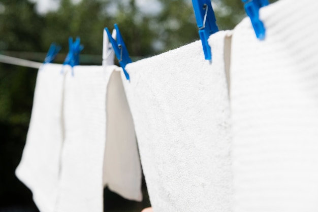 White laundry hanging on a string outdoors