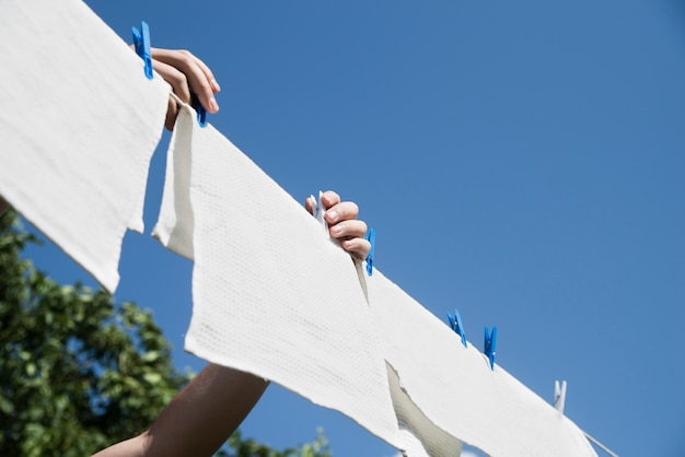 White laundry hanging on a string outdoors