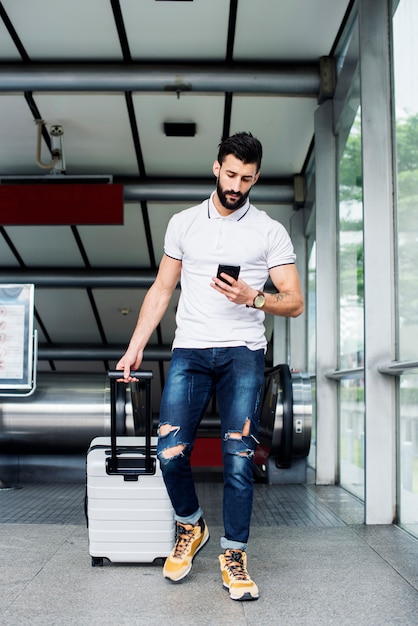 White man carrying luggage